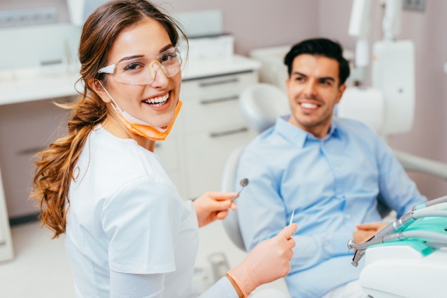 Happy patient smiling confidently after successful dental implant in Monett, MO