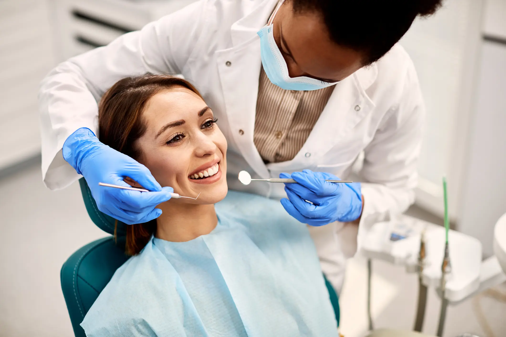 Dentist performing a routine oral checkup on a patient, emphasizing preventive care in Monett, MO